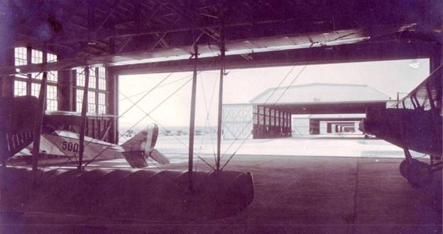 jenny JN-4 in hanger.JPG